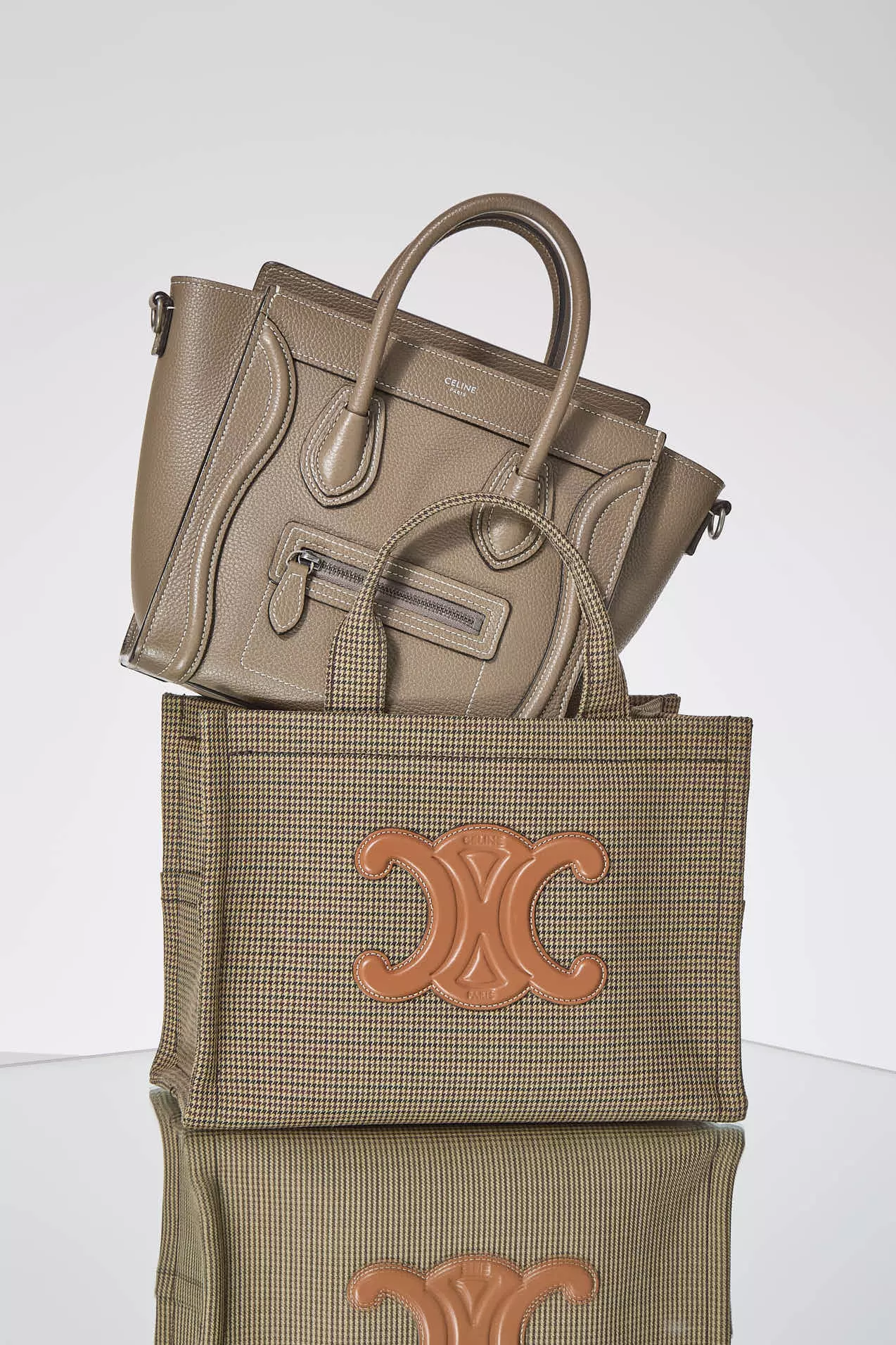 Shop by Brand: Celine Luggage tote sitting on top of a Celine top handle tote