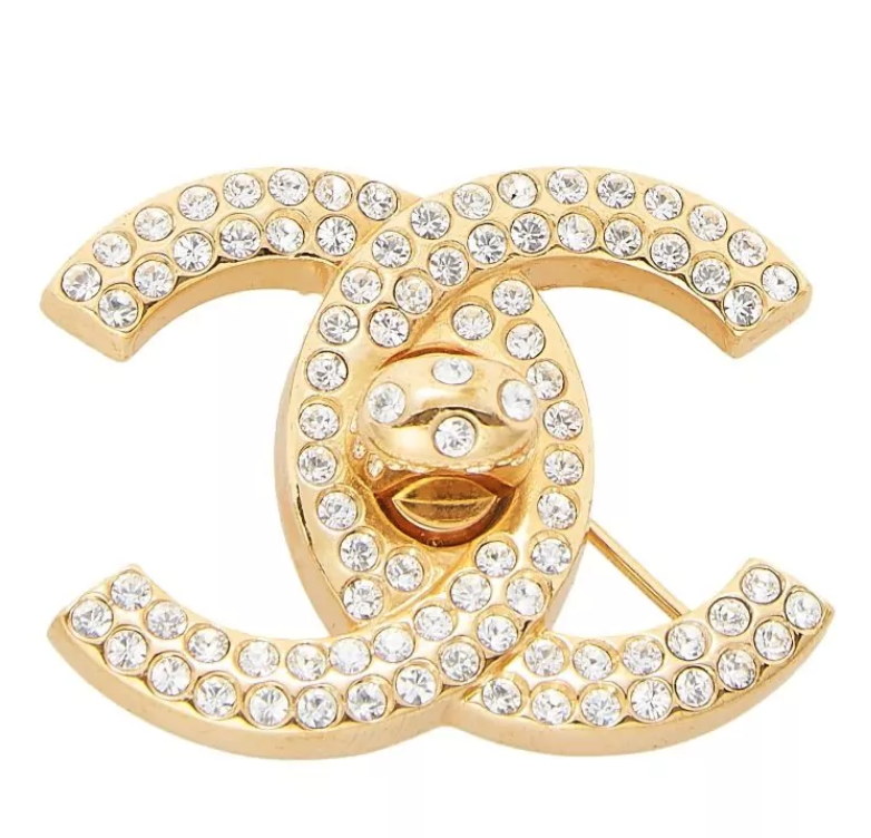 CHANEL CHANEL GOLD CRYSTAL TURNLOCK PIN, $750