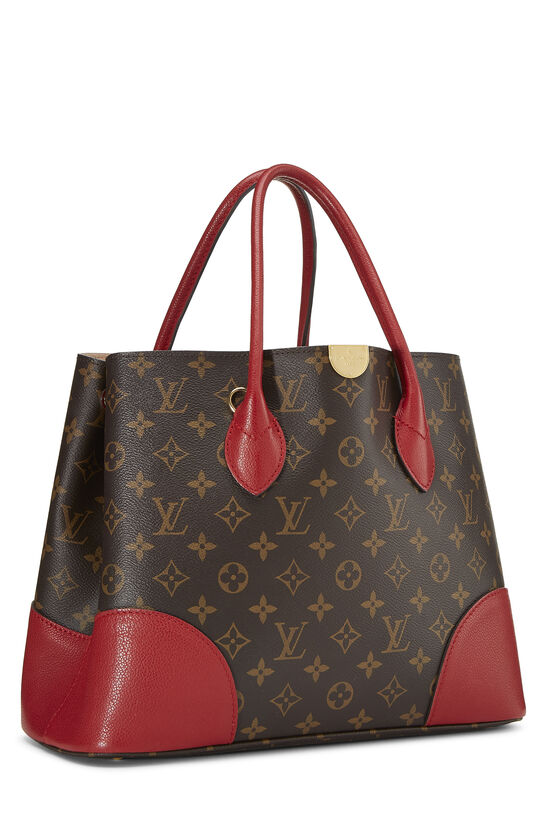 This Louis Vuitton Monogram Flandrin is made of the iconic Monogram Canvas  and red leather. Can be carried by hand, on the elbow or over…