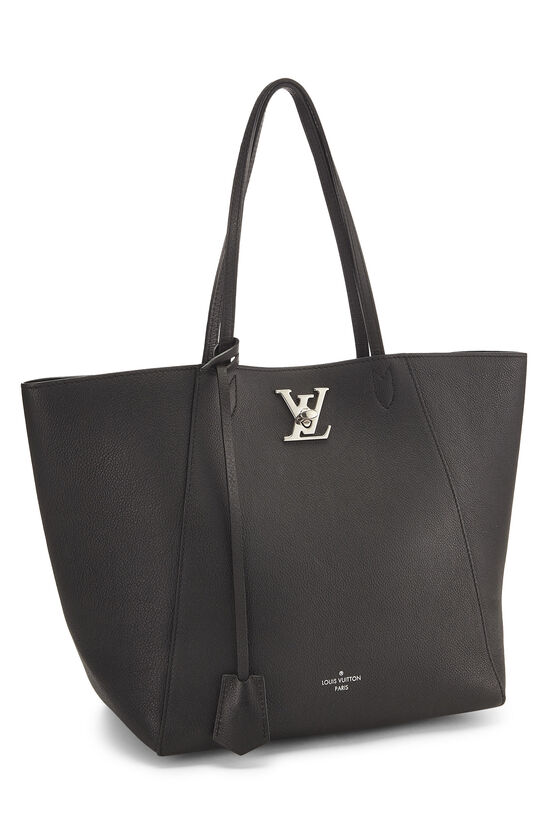 Louis Vuitton bag. Lockme Phone Pouch. Color black-creme. 