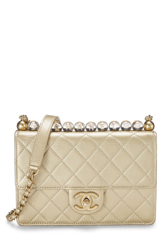 white and gold chanel purse
